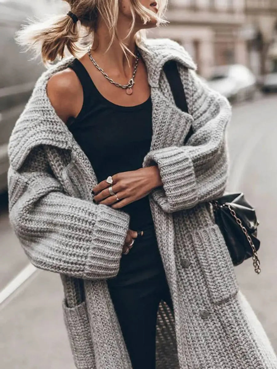 Fashionable women's oversized longline cardigan featuring a chic lapel, great for cozy winter outfits.