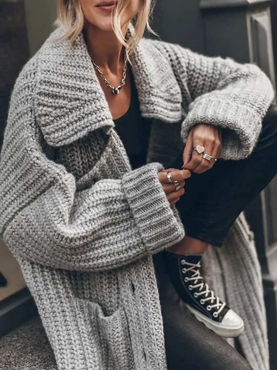 Long women's oversized lapel cardigan in a soft knit, excellent for autumn layering and casual wear.