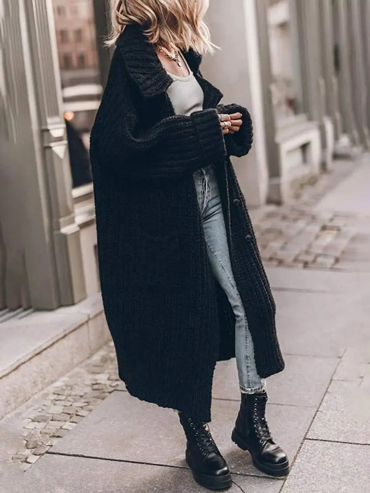 Women's oversized lapel longline cardigan, providing cozy warmth & versatile style for autumn & winter.