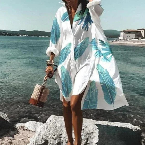 Flowy women's long sleeve oversized shirt dress, perfect as a stylish beach cover-up or resort wear.