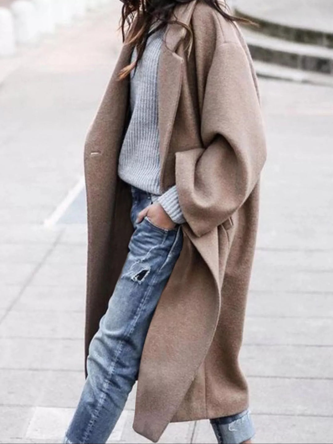 Women's oversized long winter coat, providing warmth and a stylish, relaxed fit for cold weather.