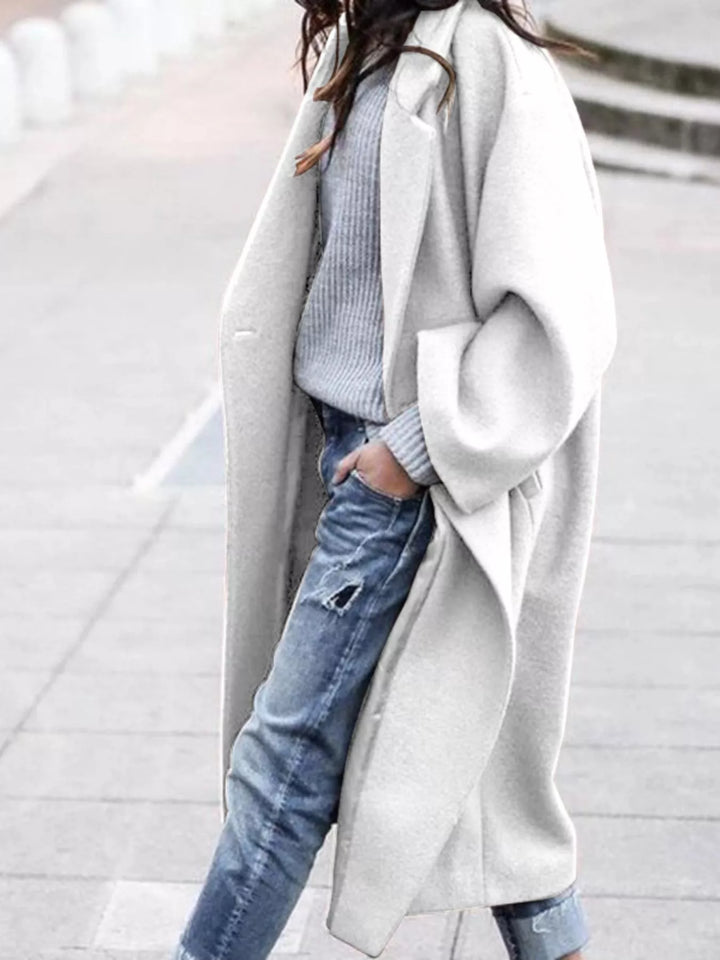 Women's extra-long oversized winter coat, offering extended warmth and a dramatic fashion statement.