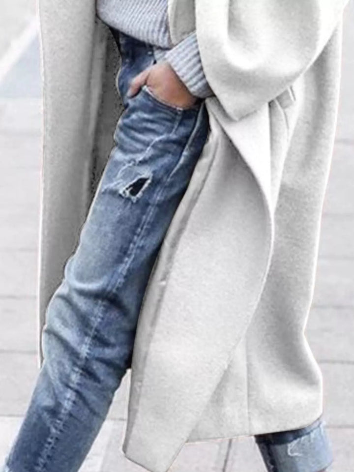 Durable women's oversized long winter coat, providing superior insulation and a chic, comfy fit.