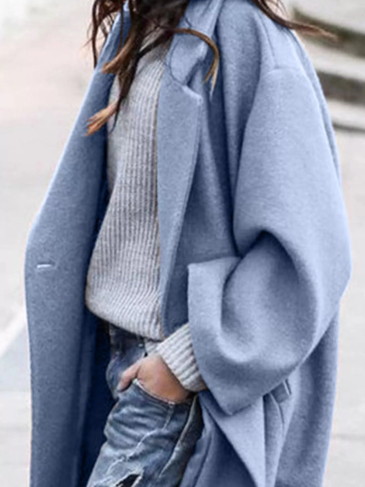 Soft women's oversized long winter coat, ensuring cozy comfort and a stylish silhouette.