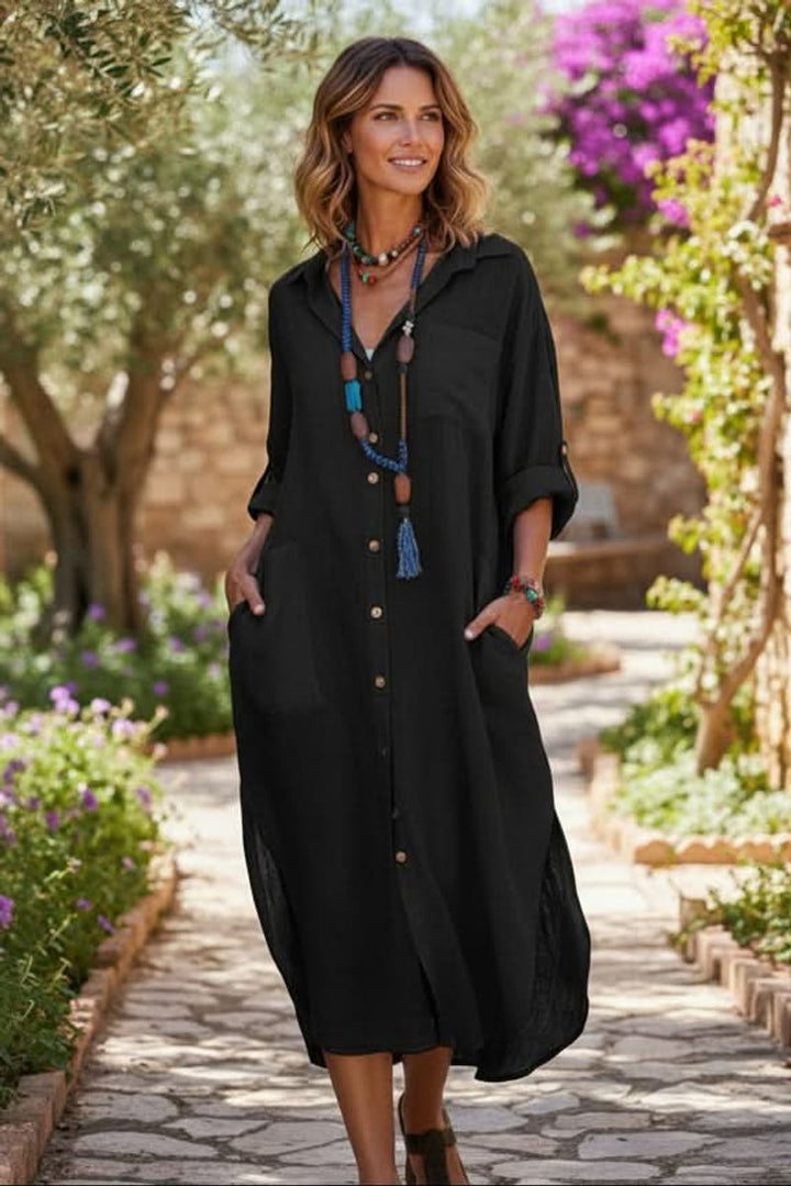 Flowy V-neck women's midi dress with roll-tab sleeves, ideal for resort wear & vacation outfits.