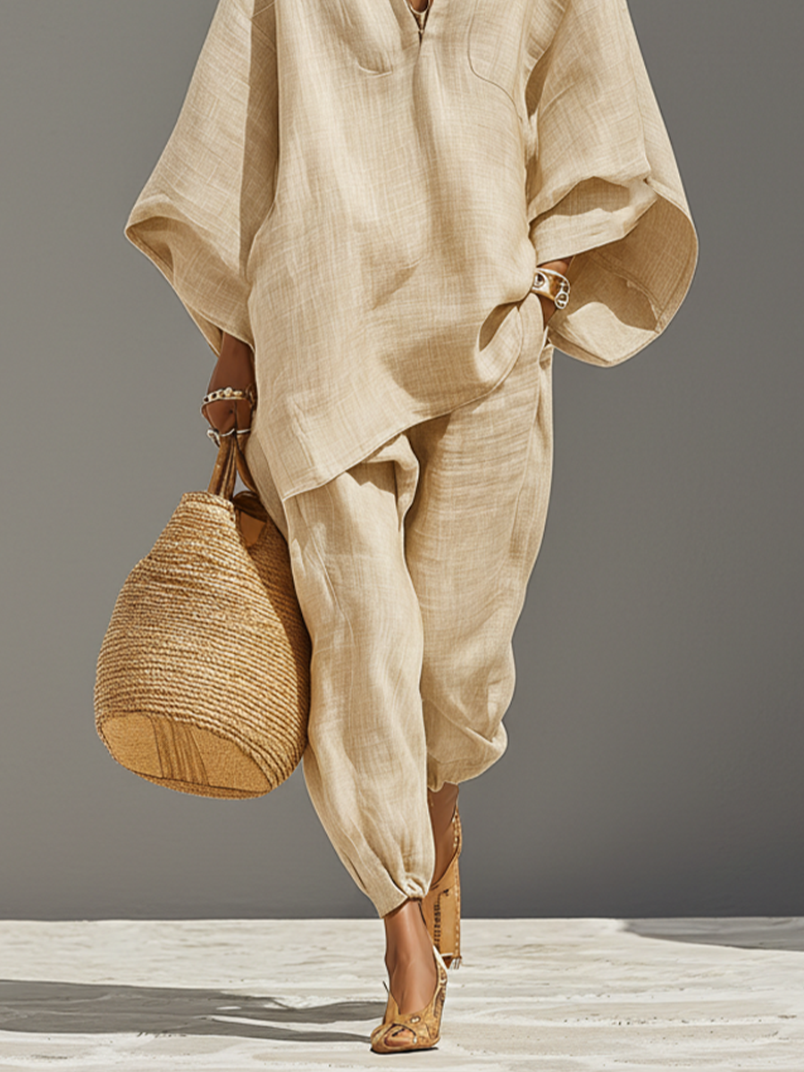 Elegant women's oversized set featuring a notched top & tapered pants. Great for a relaxed yet chic casual outfit.
