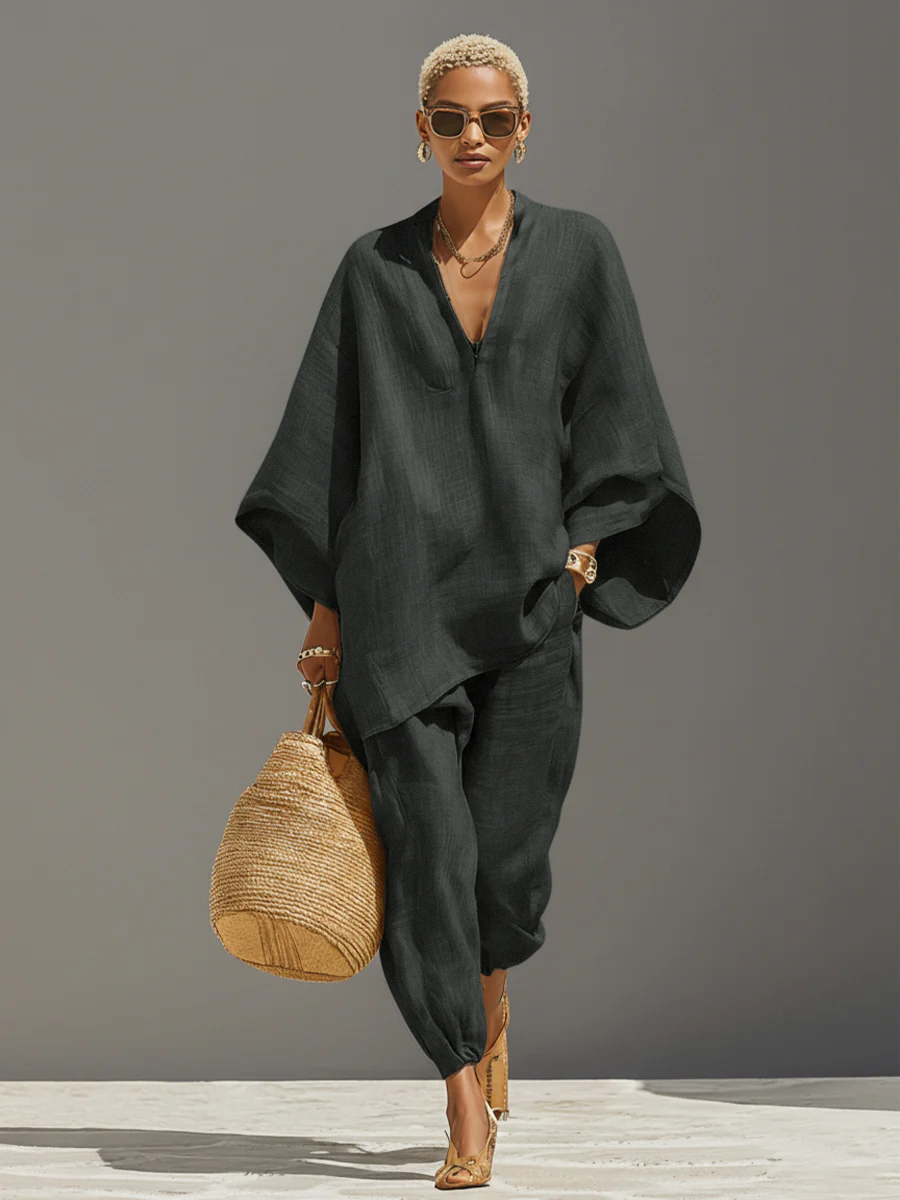 Oversized women's coordinated set: trendy notched top with comfortable tapered pants. Ideal for modern casual style.