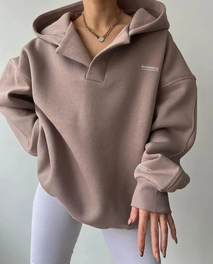 Soft women's oversized hoodie, perfect for loungewear or everyday fashion. Pullover with notch neck.