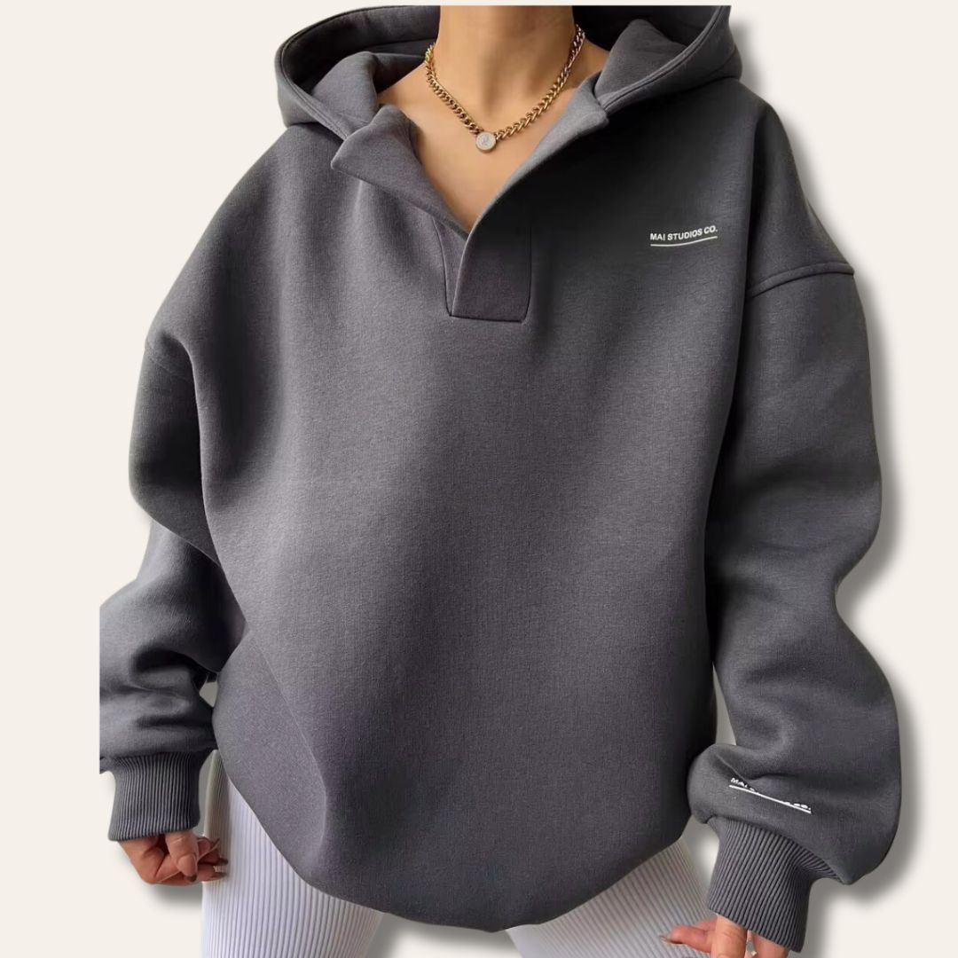 Cozy women's oversized hoodie, perfect loungewear. Soft pullover with a modern notch neck design.