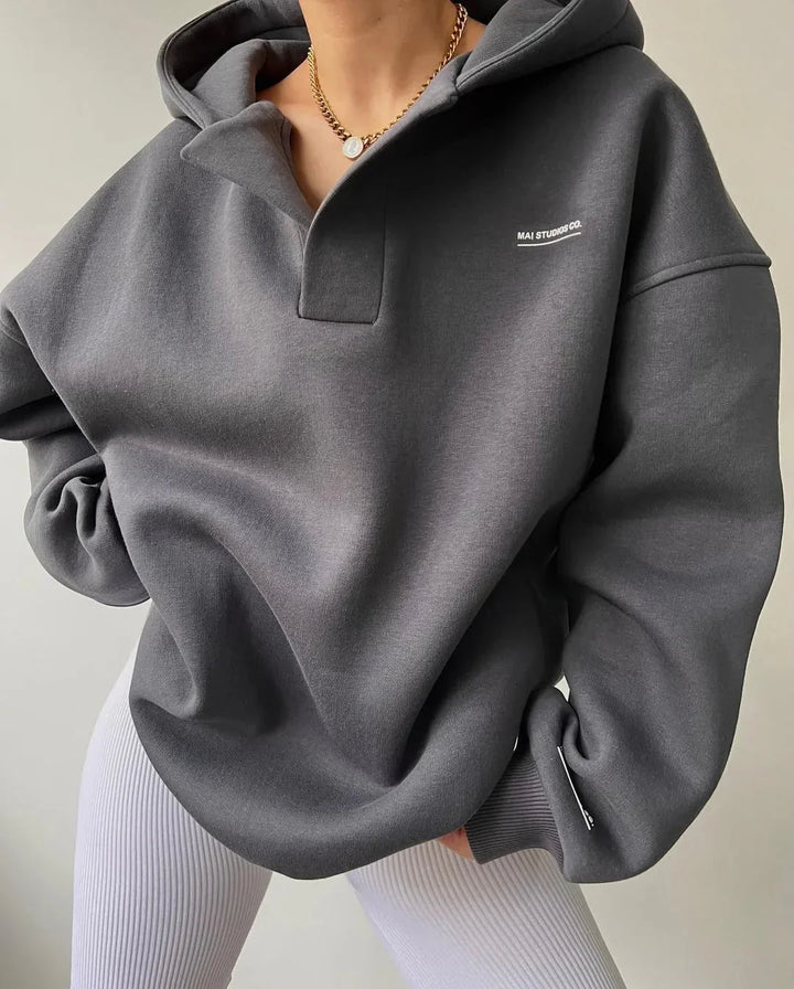 Comfortable women's oversized hoodie with a relaxed fit, drop shoulder sleeves, and chic notch neck.