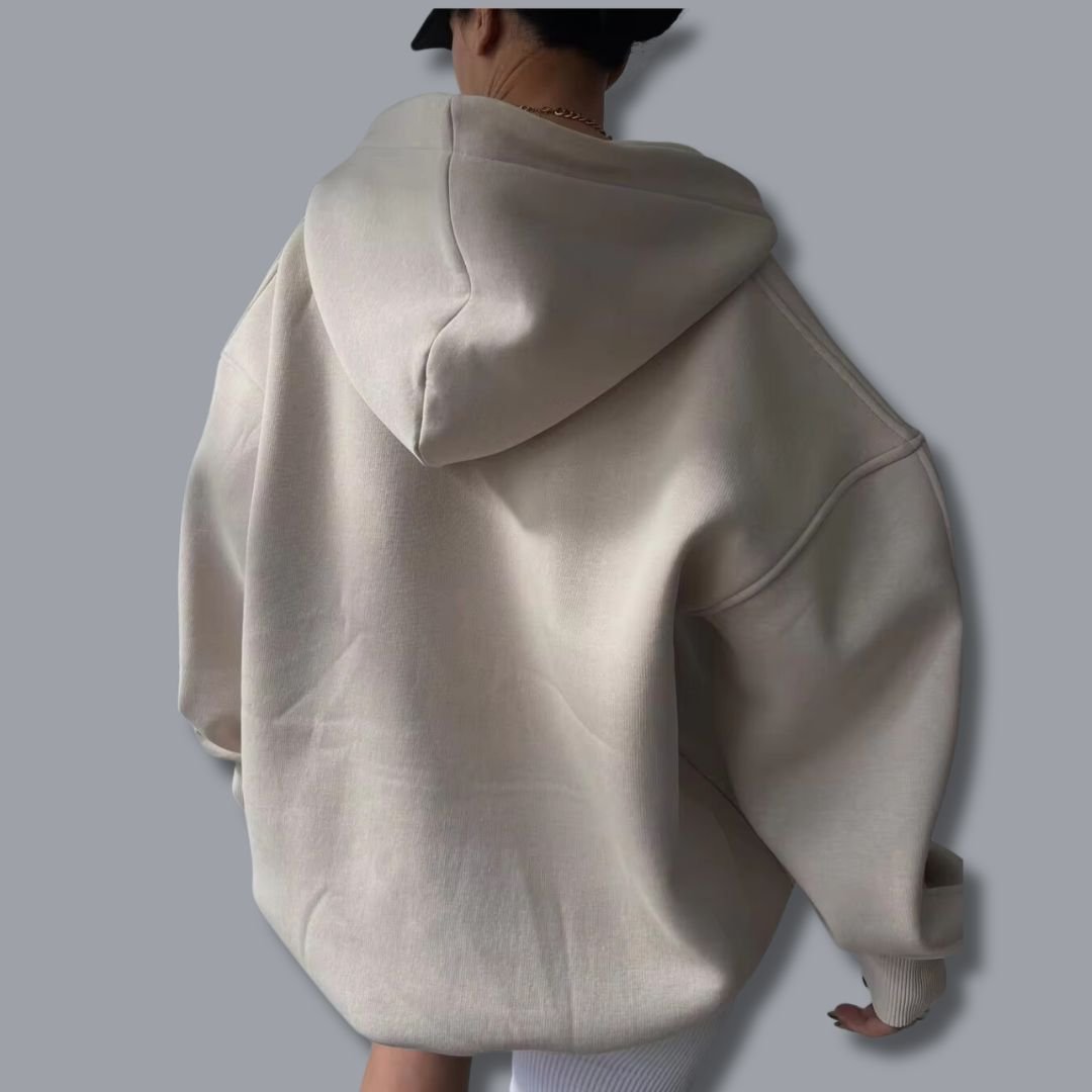 Relaxed fit women's oversized hoodie, a comfortable pullover with a modern notch neck detail.