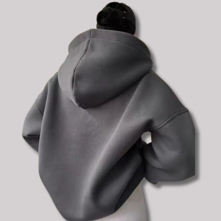 Chic women's oversized pullover hoodie for casual fashion. Features a drop shoulder and unique notch neck.
