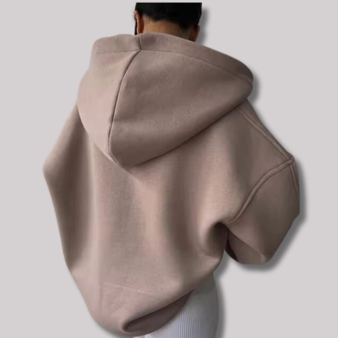 Warm women's oversized hoodie, a comfortable pullover with a stylish notch neck, great for cozy days.