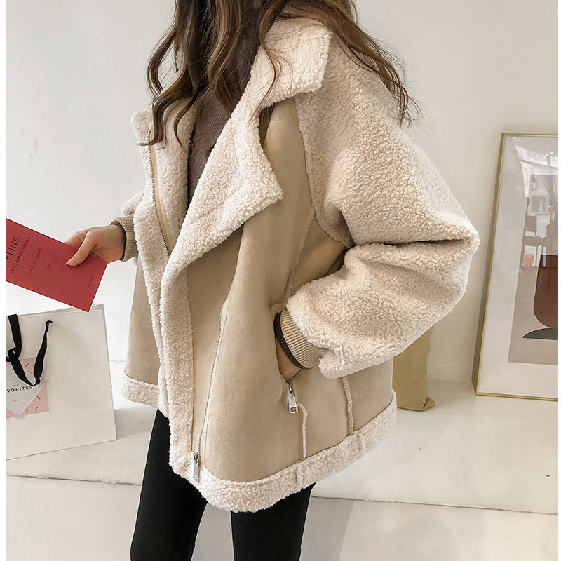 Trendy women's oversized sherpa jacket. Versatile zip-up outerwear for winter fashion, offering warmth & comfort.