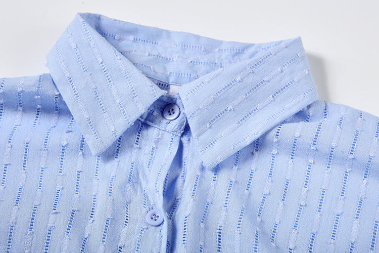 Woman relaxing in a comfortable oversized striped summer shirt & shorts set. Perfect spring/summer style.