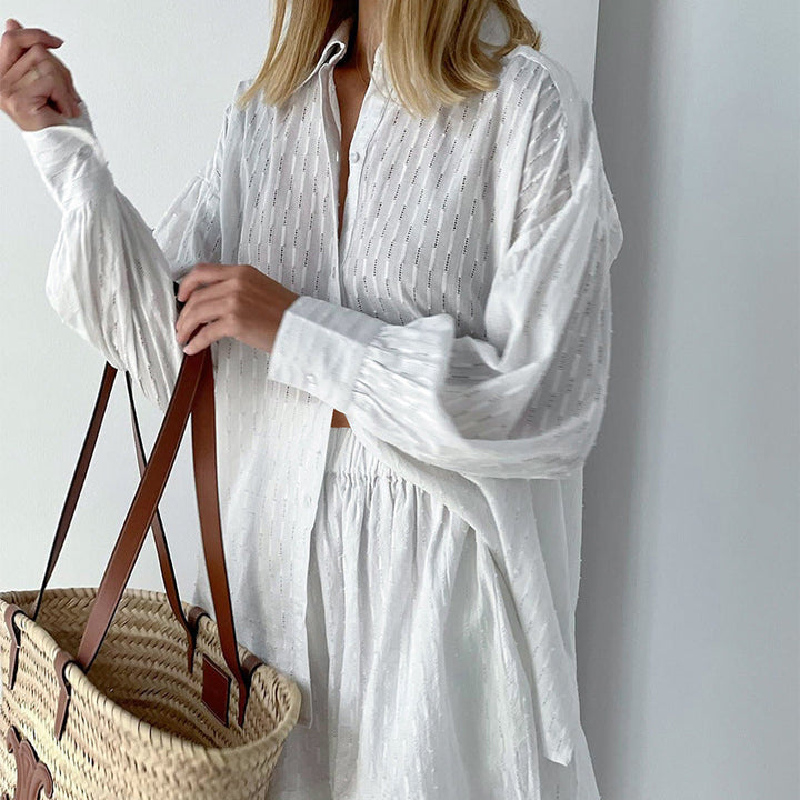 Close-up of the striped fabric texture on a women's oversized summer shirt and shorts two-piece set.