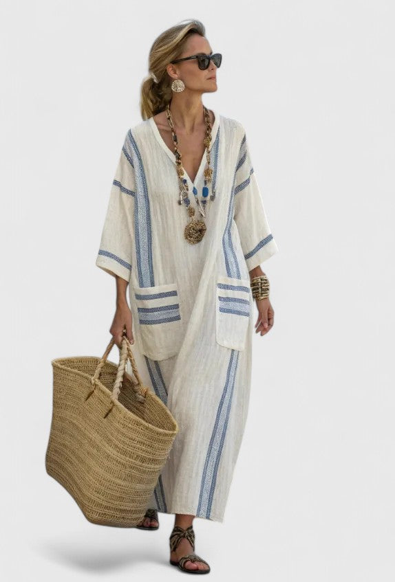 Stylish women's oversized striped kaftan maxi dress. Comfortable V-neck summer dress, great for beach or casual.