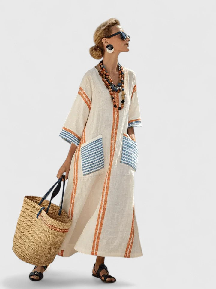 Trendy women's oversized striped kaftan maxi dress. Versatile V-neck design for resort, beach, or casual summer.