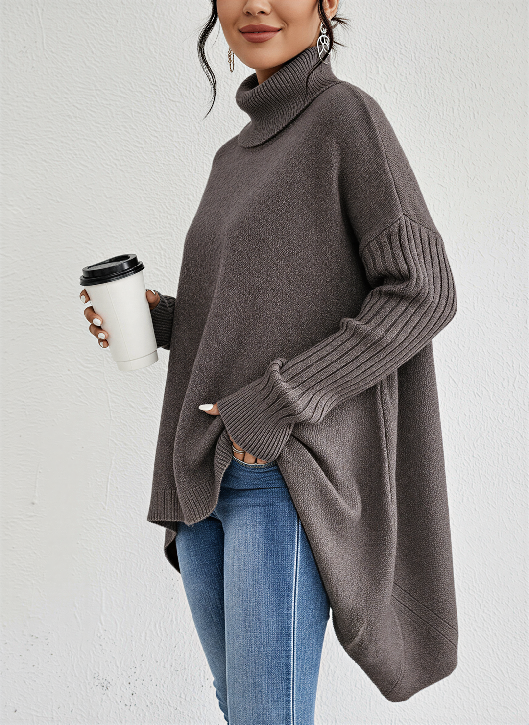 Fashionable women's cozy oversized turtleneck sweater, great for a warm and stylish winter outfit.