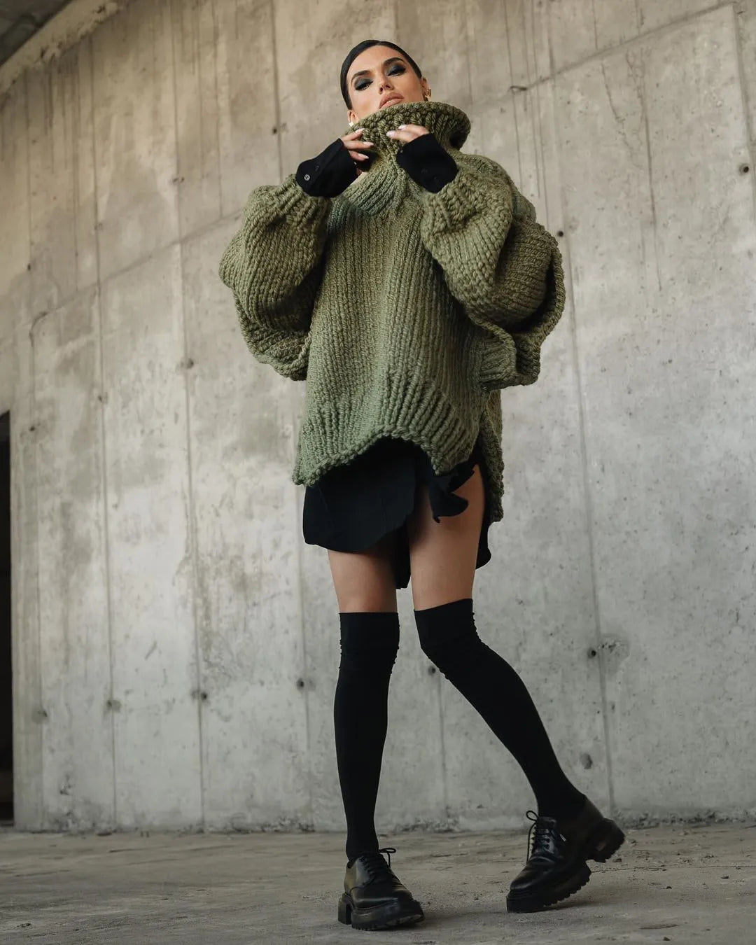 Women's oversized turtleneck sweater dress in a cozy knit, perfect for winter and fall styling.