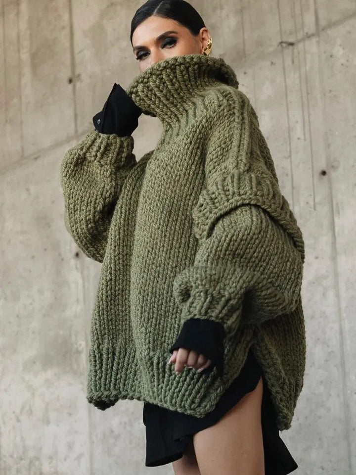 Elegant women's oversized turtleneck sweater mini dress with long sleeves for autumn comfort.