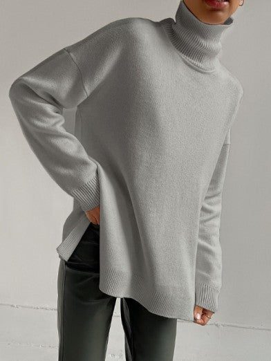 Versatile women's oversized turtleneck sweater. A chic, warm knitwear piece with side slits for fall/winter.