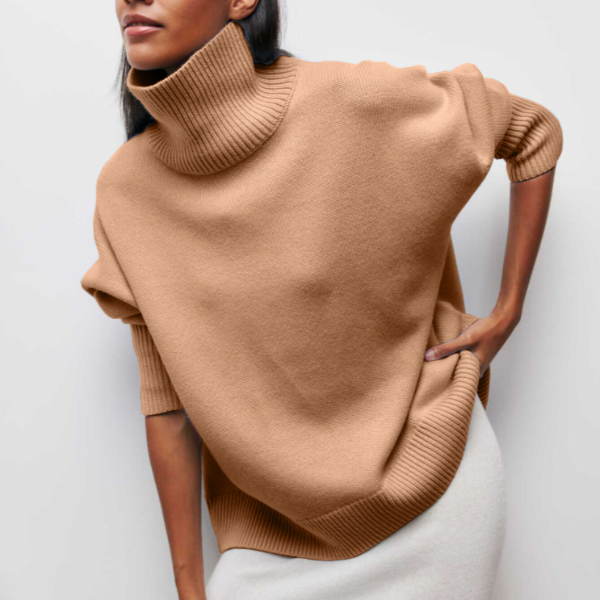 Chic women's oversized turtleneck sweater. Stylish comfort, cozy knitwear, ideal relaxed fit for autumn/winter layering.