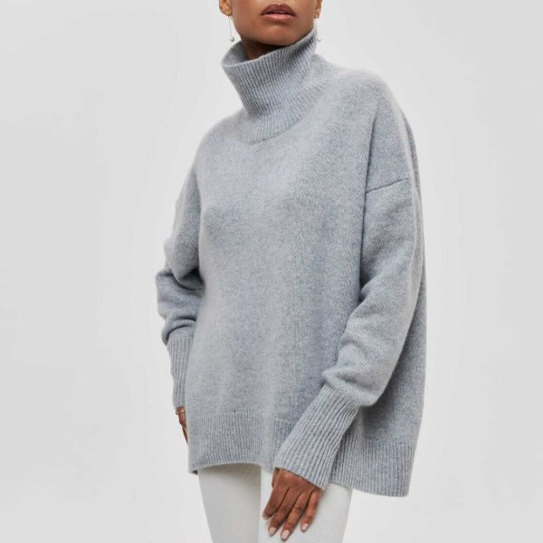 Soft women's oversized turtleneck sweater. A cozy knit jumper with long sleeves, perfect for relaxed autumn/winter outfits.