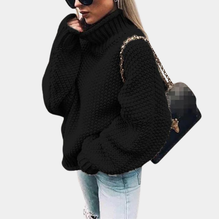 Cozy women's oversized turtleneck sweater with a relaxed fit, ideal for comfortable casual winter fashion.