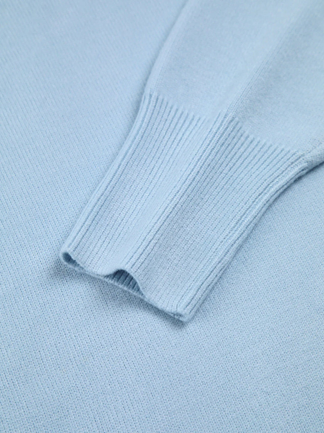 Stylish women's oversized turtleneck pullover, featuring unique elbow slits for a modern, cozy look.
