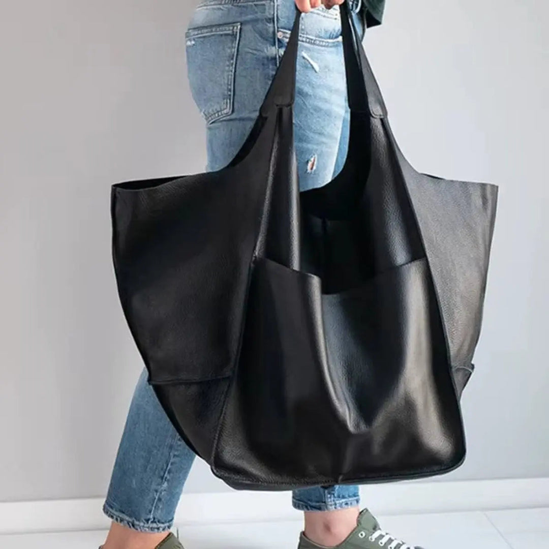 Practical women's oversized vegan leather everyday bag, magnetic closure keeps items secure.