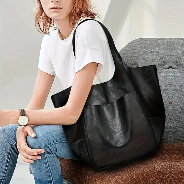 Trendy women's oversized vegan leather handbag, magnetic closure, a must-have fashion tote.