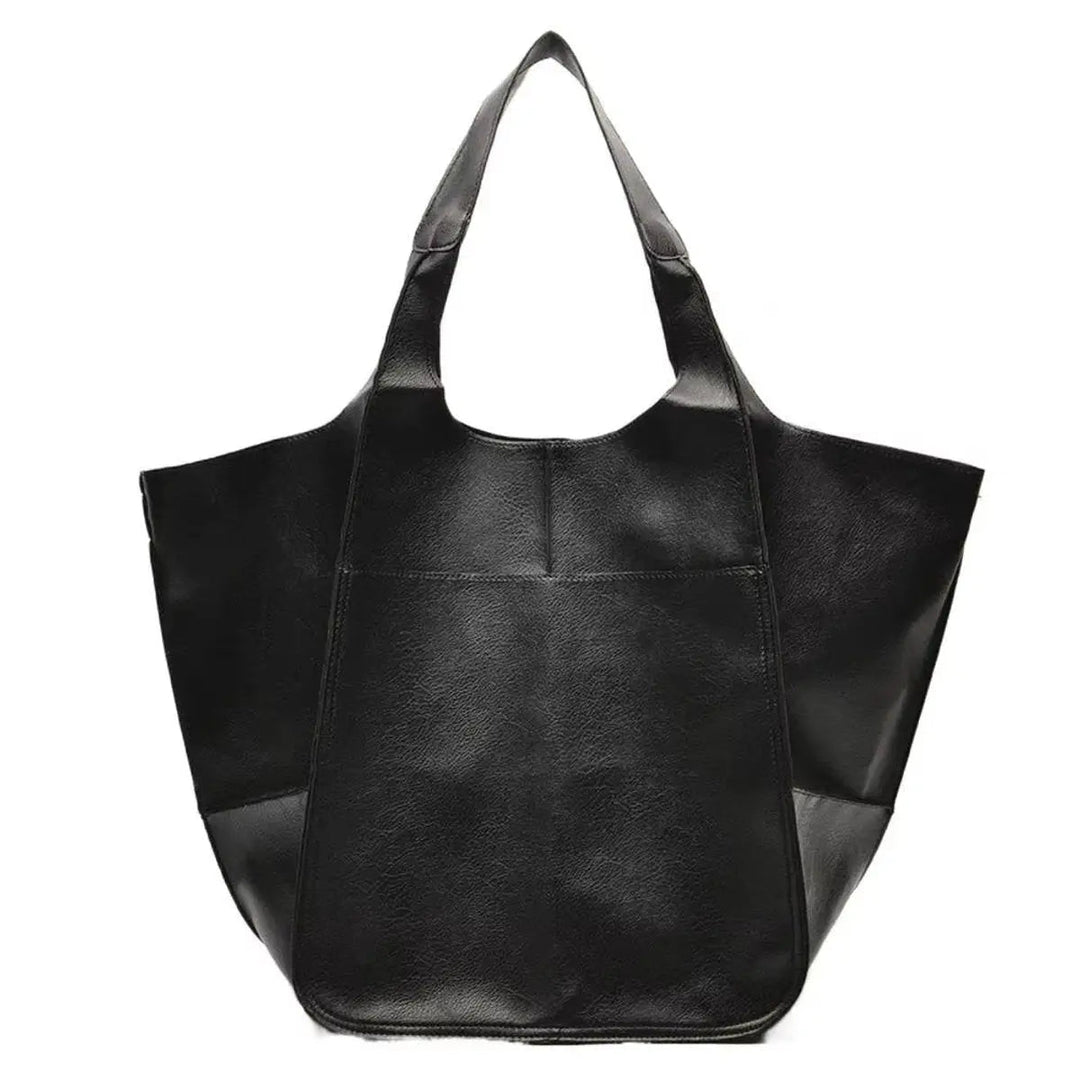 Spacious women's oversized vegan leather tote, magnetic closure, perfect for work or travel.