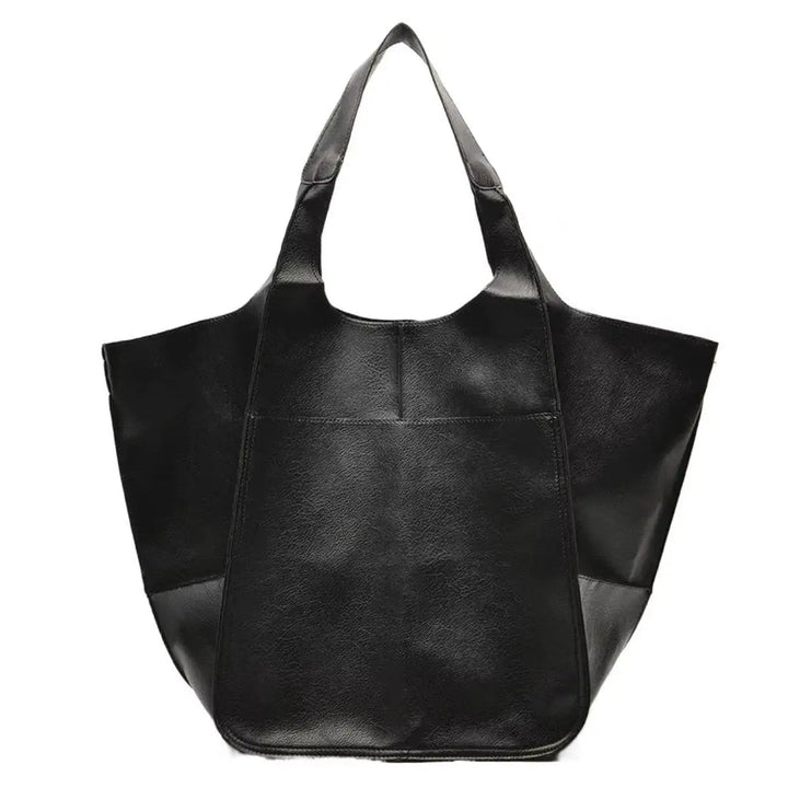 Spacious women's oversized vegan leather tote, magnetic closure, perfect for work or travel.