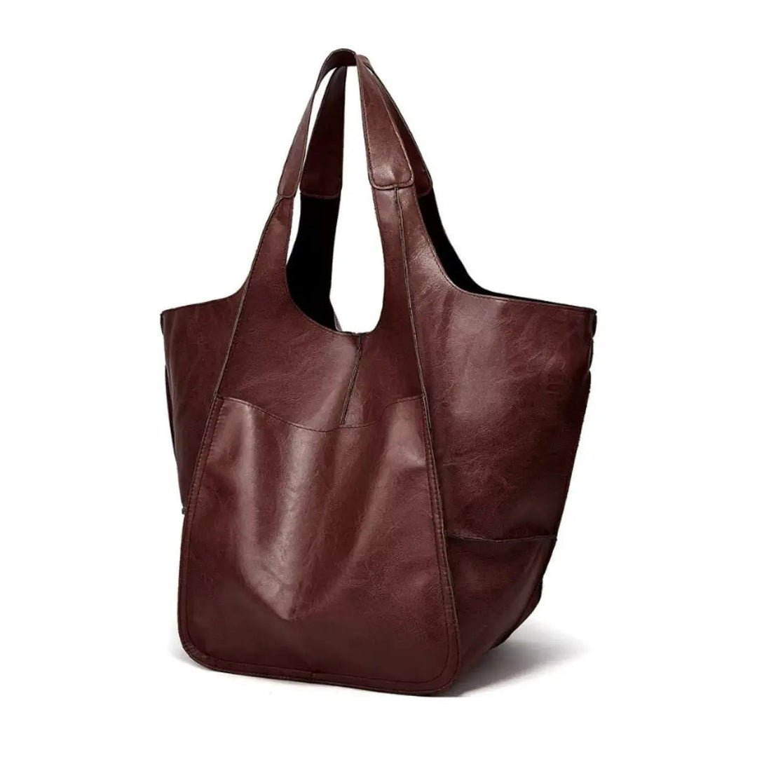 Comfortable women's oversized vegan leather shoulder bag, magnetic closure, combines style & ease.