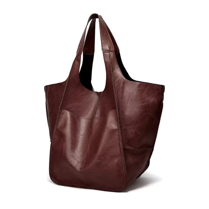 Comfortable women's oversized vegan leather shoulder bag, magnetic closure, combines style & ease.