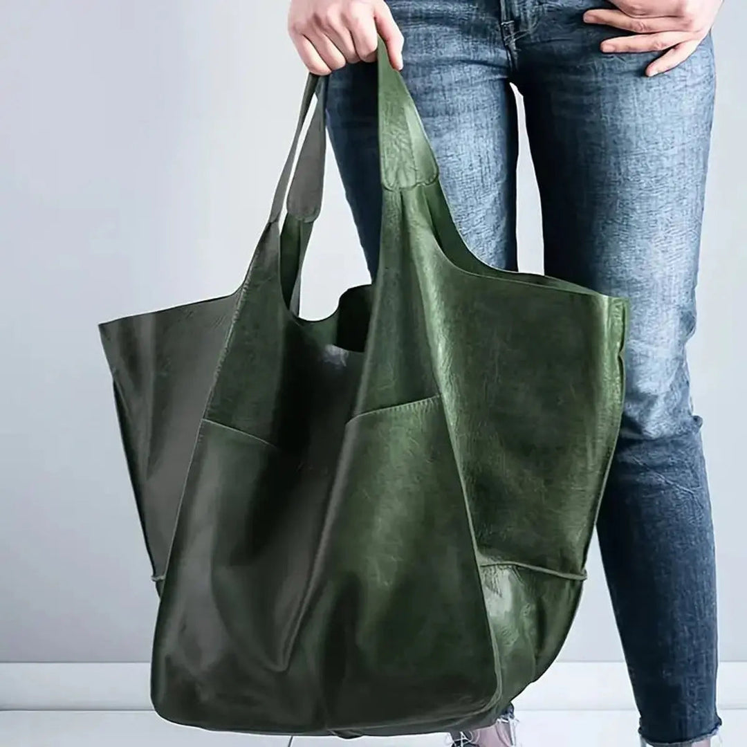 Stylish women's oversized vegan leather shoulder bag, magnetic closure, perfect for work or fashion.