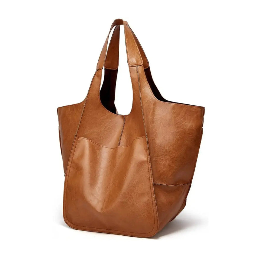 Elegant women's oversized vegan leather tote, magnetic closure, ideal for any occasion.