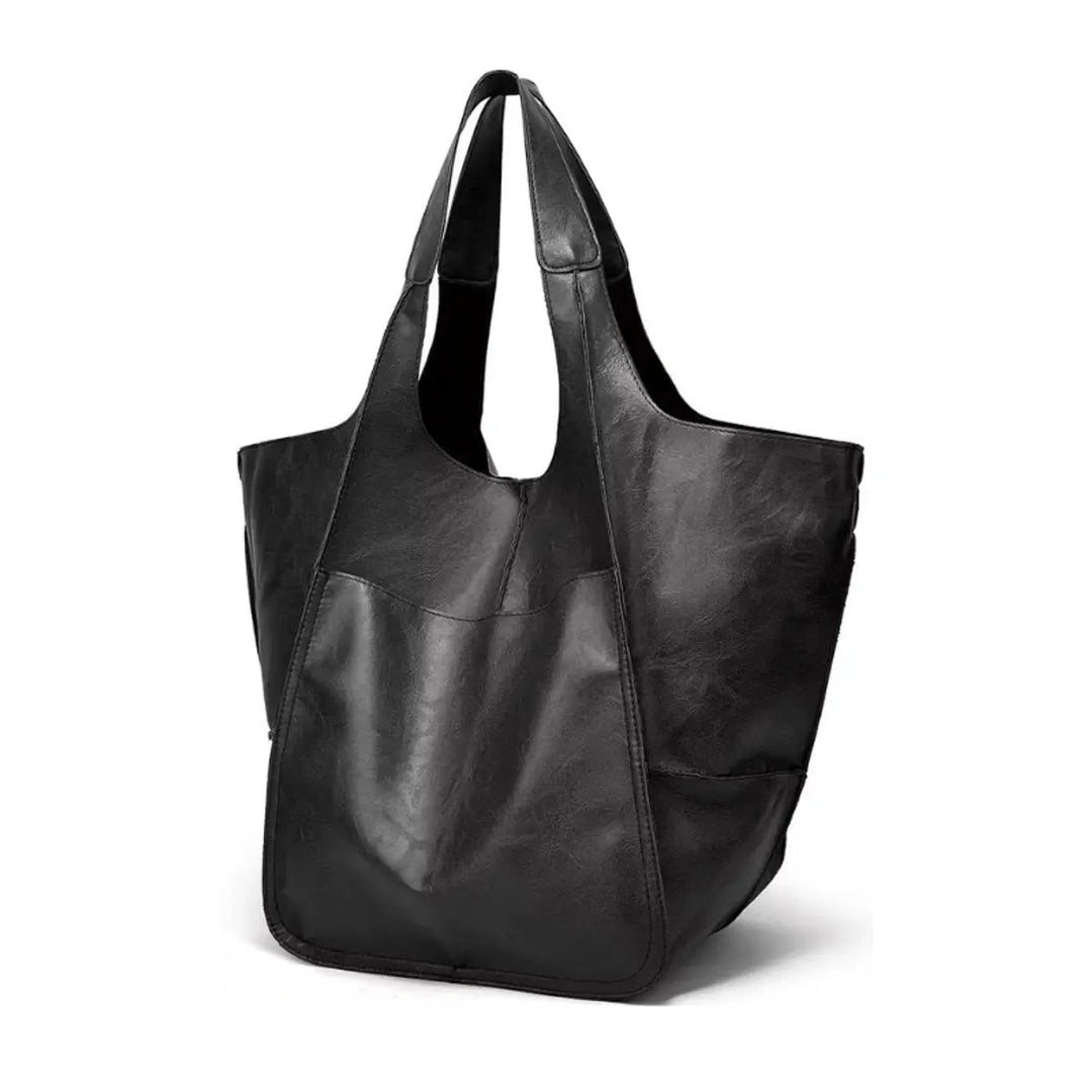 Durable & chic women's oversized vegan leather tote bag with magnetic closure, perfect for everyday.