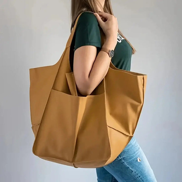Large vegan leather tote bag for women, magnetic closure, spacious for work & daily essentials.