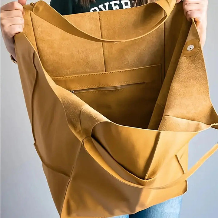 Chic women's oversized vegan leather handbag, magnetic closure, a versatile everyday & work bag.