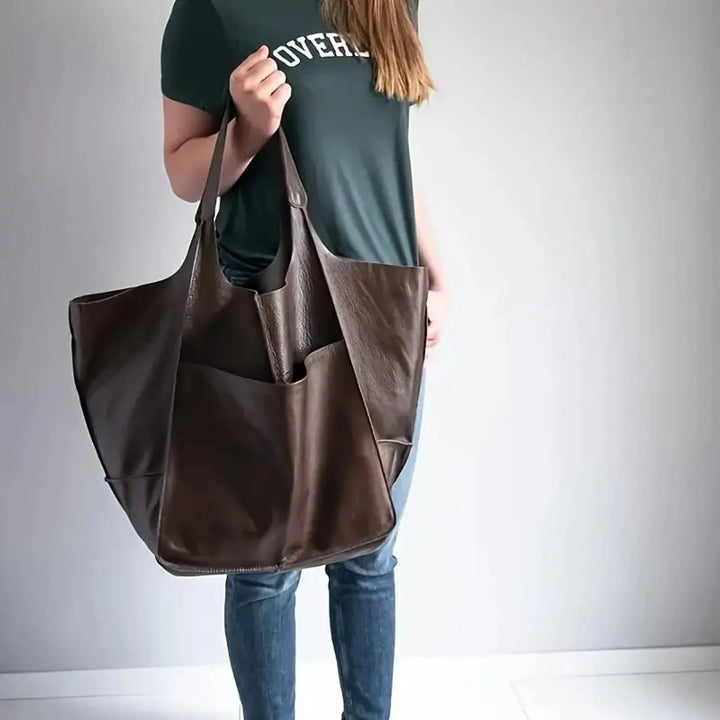 Oversized vegan leather tote bag for women with magnetic closure, a stylish & practical handbag.