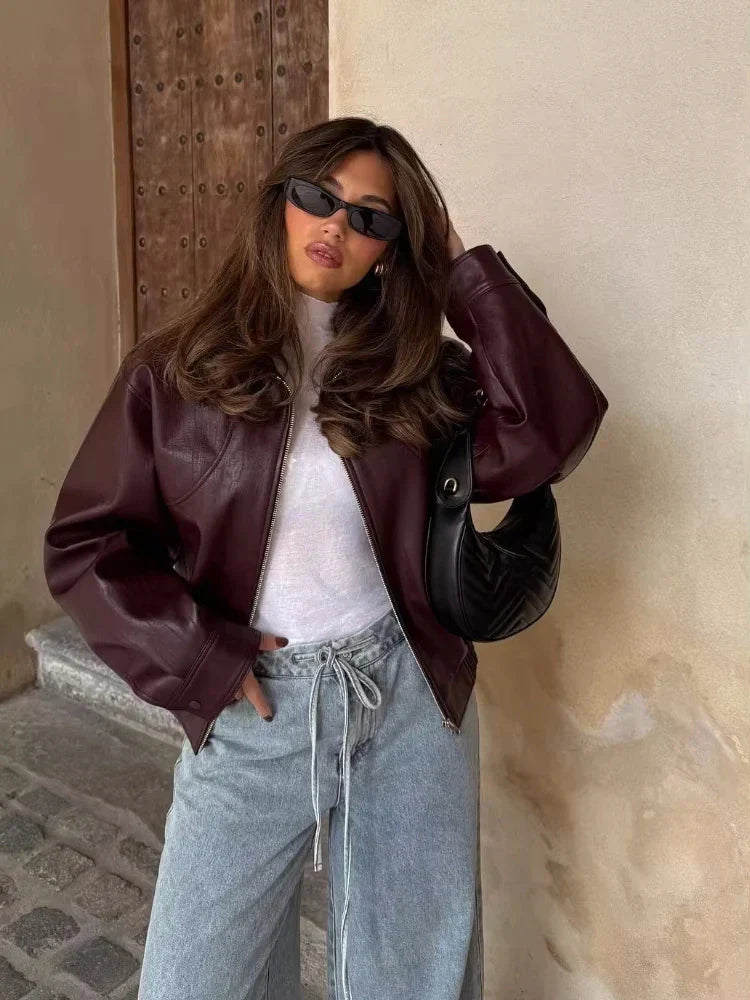Women's oversized wine red leather jacket, waist-length, perfect for spring fashion & streetwear.