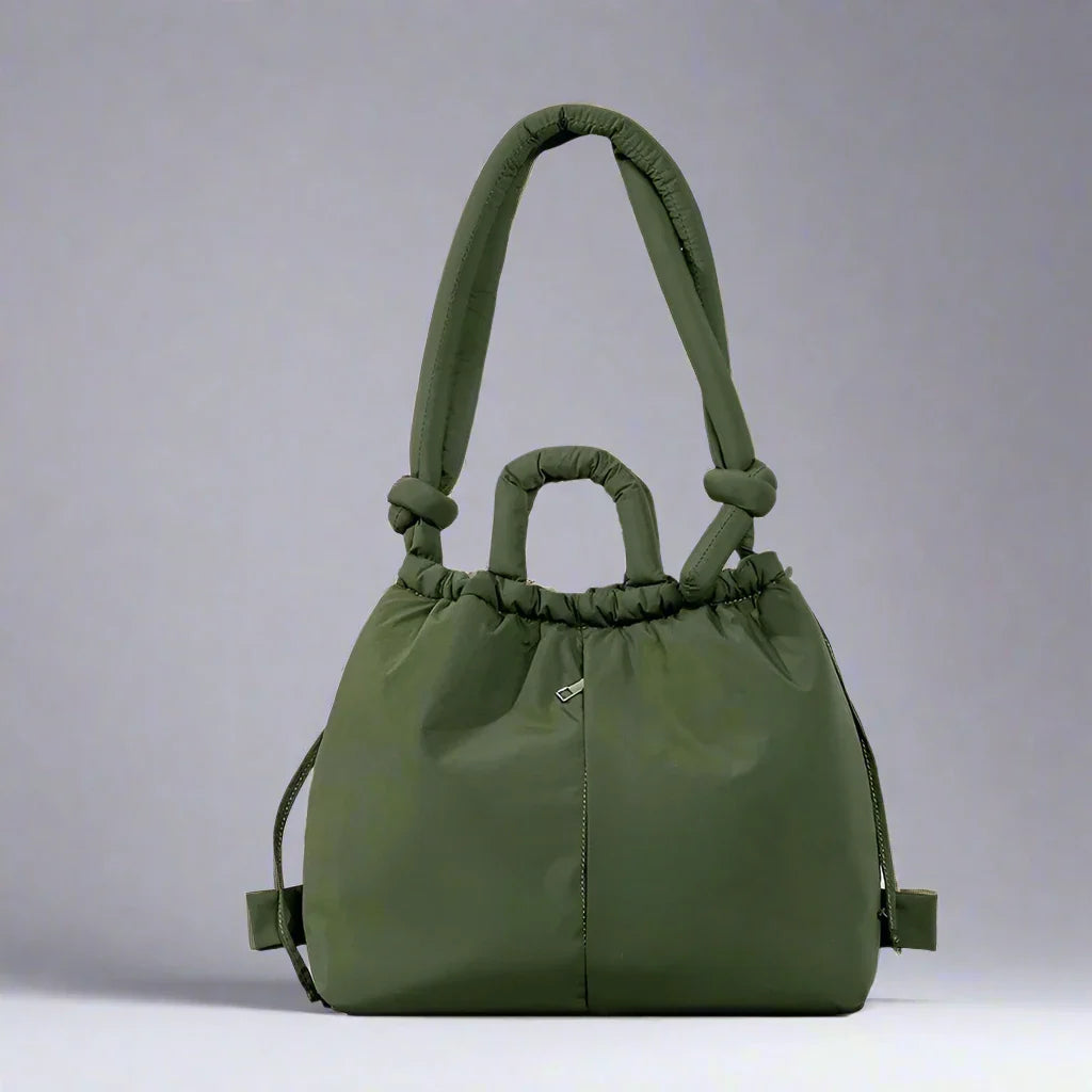 Chic women's padded tote bag with drawstring closure. Versatile and lightweight everyday handbag.