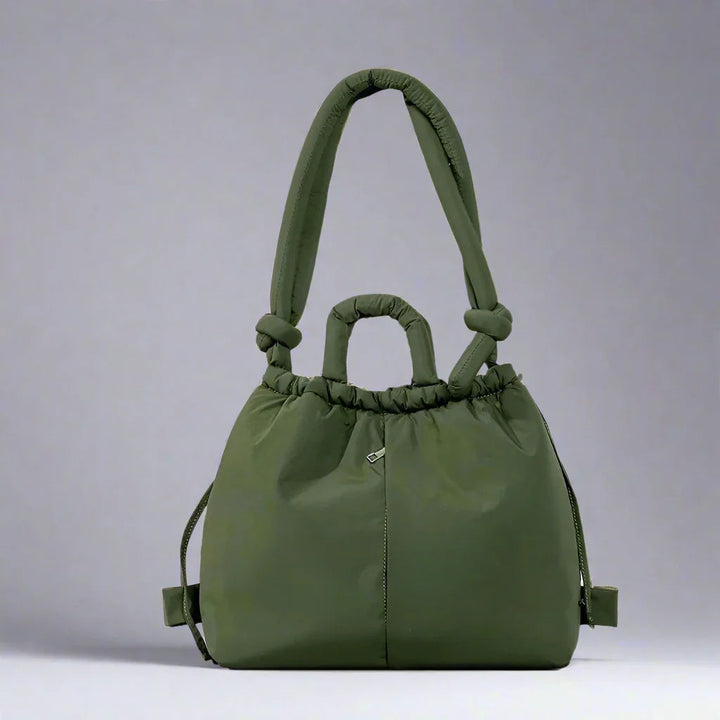 Chic women's padded tote bag with drawstring closure. Versatile and lightweight everyday handbag.