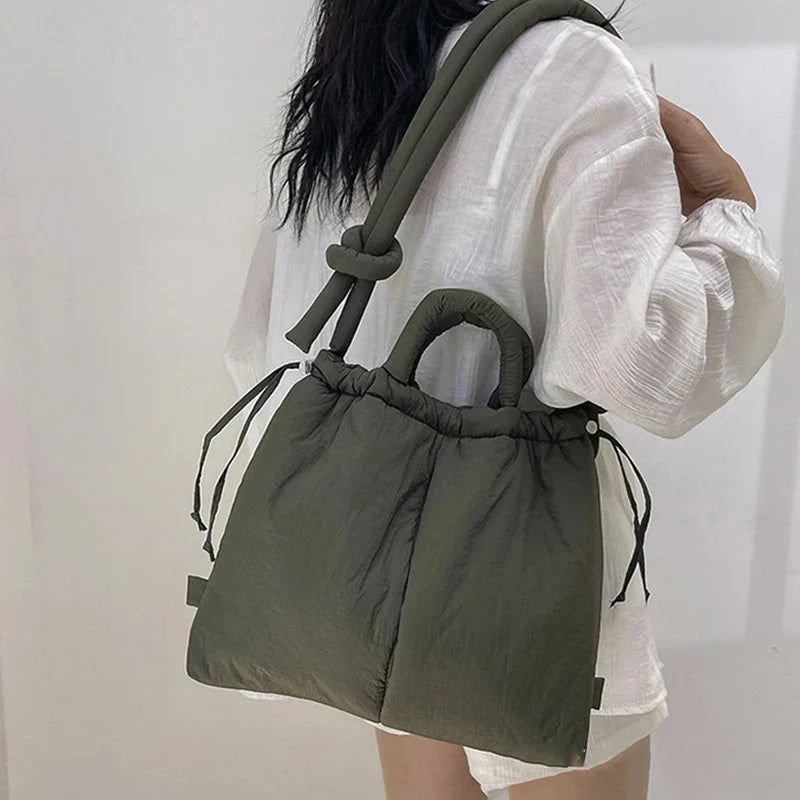 Everyday women's tote bag. Padded design, drawstring closure, lightweight & stylish shoulder purse.