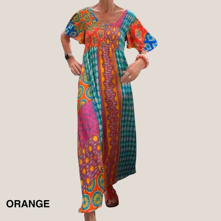 Women's paisley V-neck midi dress with smocked waist & short sleeves, ideal for spring & summer.