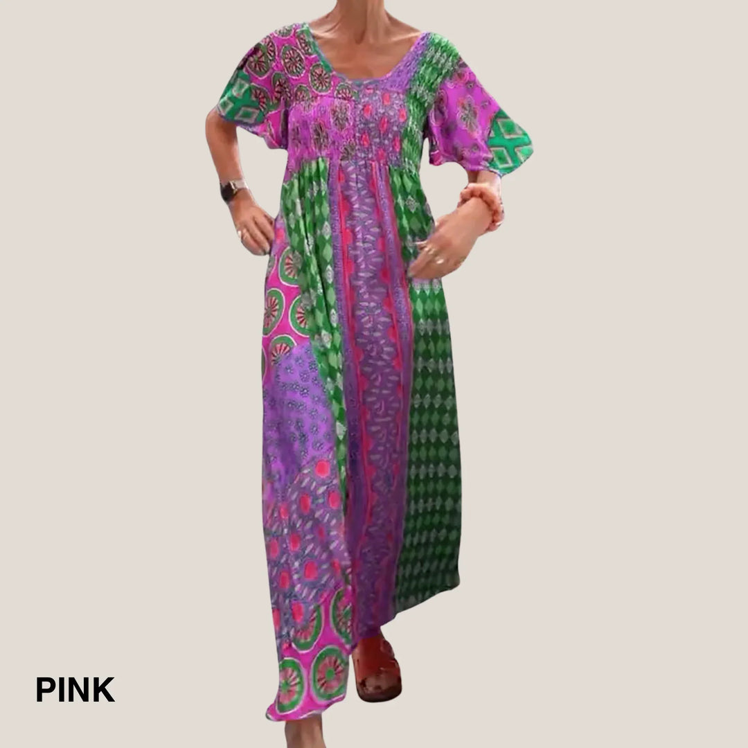 Vibrant paisley V-neck midi dress with smocked waist, short sleeves, a chic boho summer fashion statement.