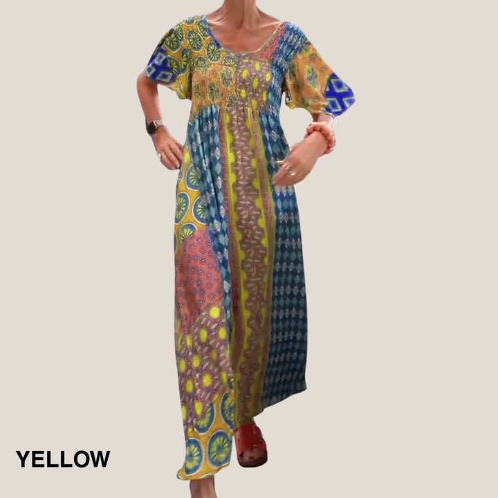 Comfortable women's V-neck midi dress featuring a colorful paisley print and flattering smocked waist design.