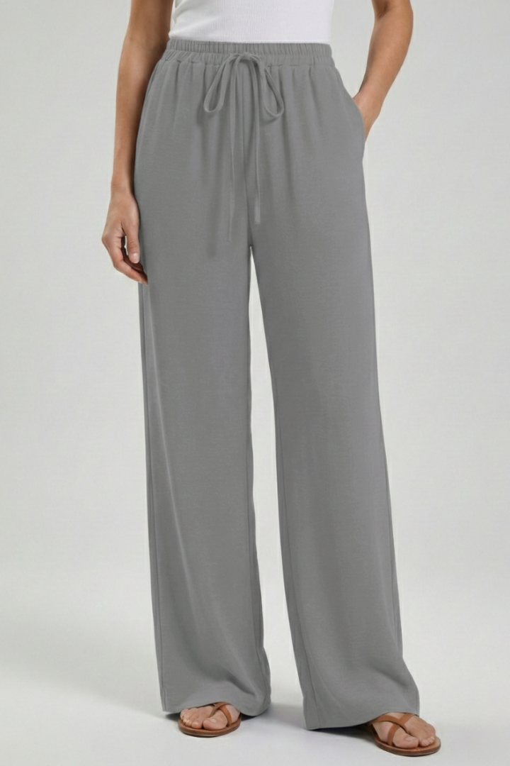Trendy women's wide-leg palazzo trousers, drawstring waist, and practical deep pockets.